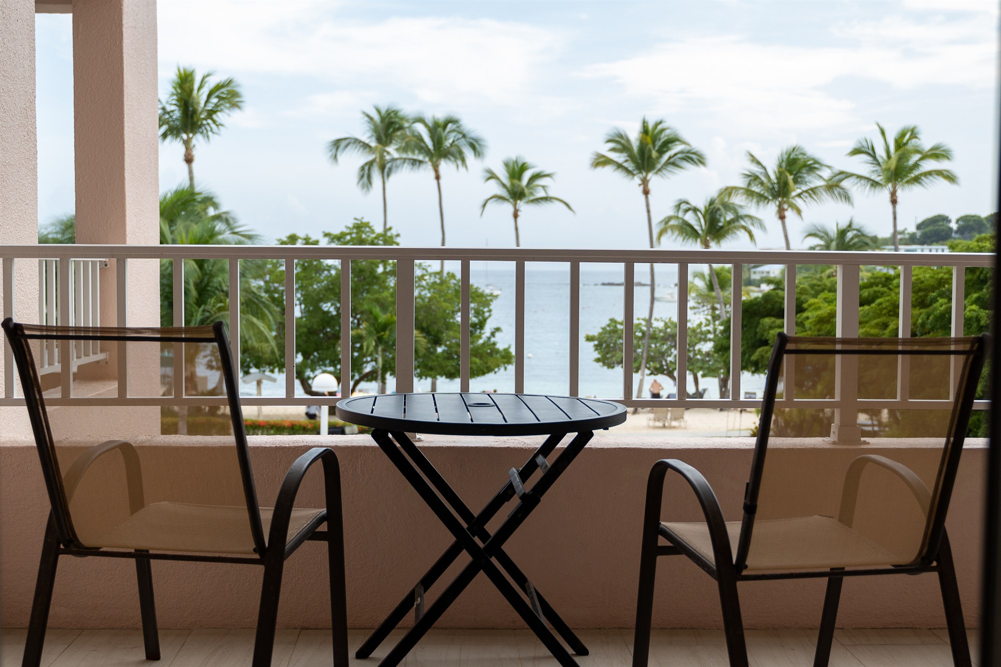 Downtime beachfront condo patio with ocean views